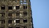 Facaden på højhuset Grenfell Tower efter den branden.